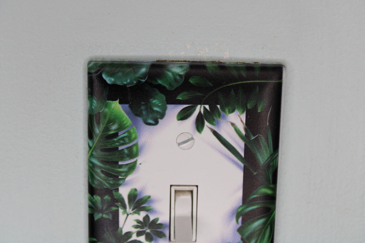 deep green forest jungle houseplants palm monstera leaves plants light switch plate cover printed durable green decor unique custom piece