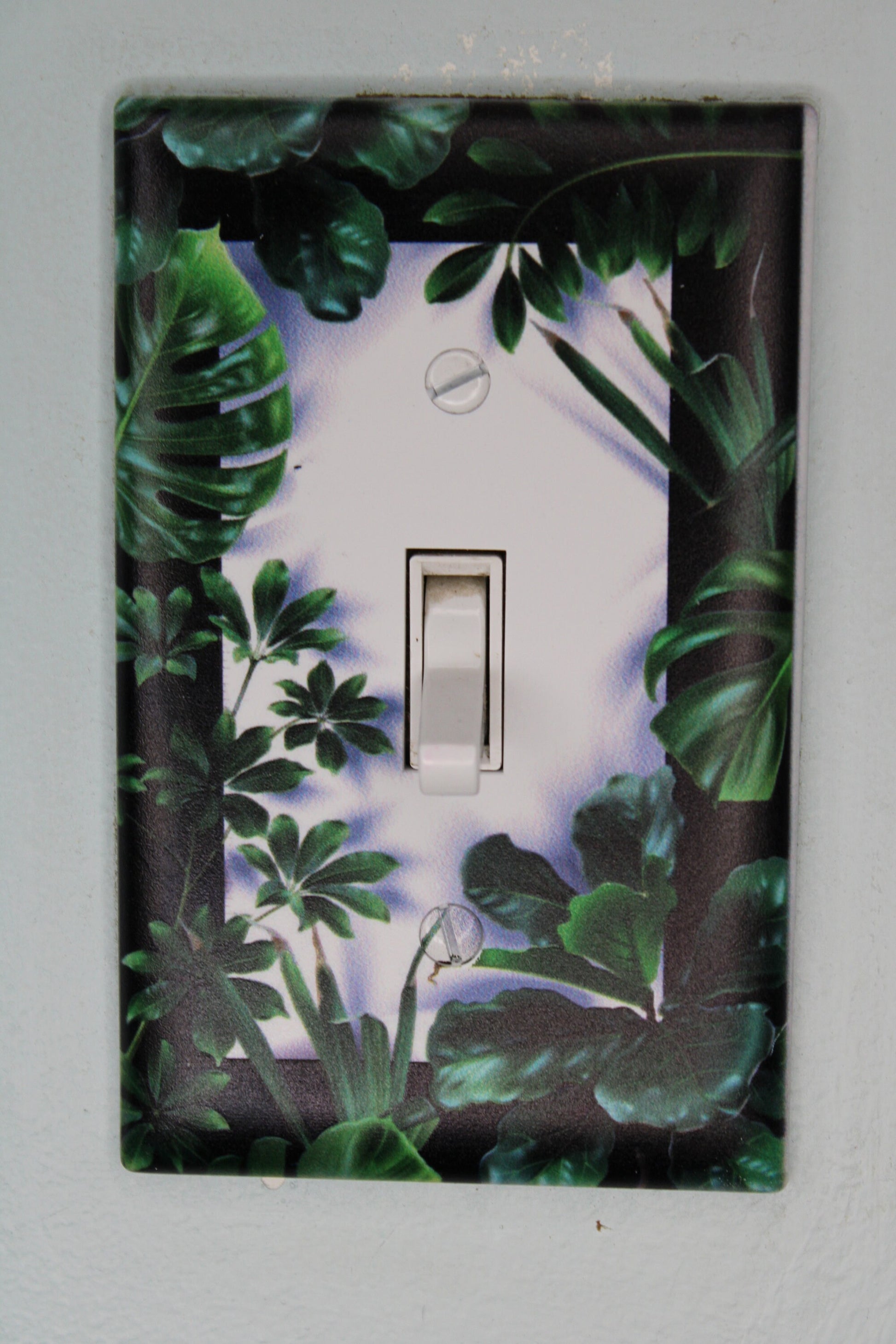 deep green forest jungle houseplants palm monstera leaves plants light switch plate cover printed durable green decor unique custom piece